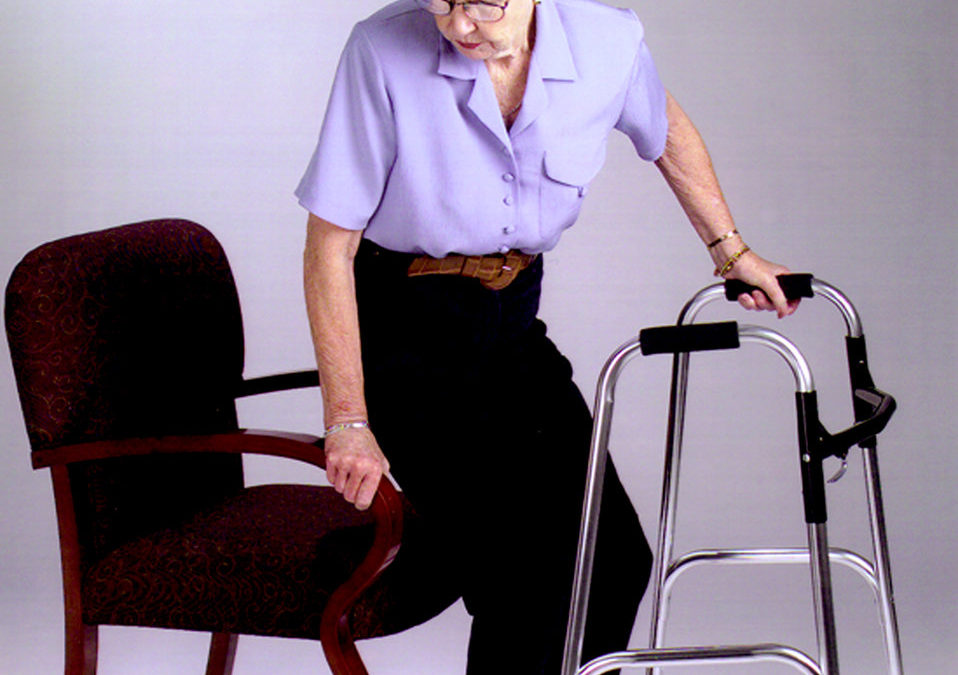 an arthritic woman with a walker trying to sit down