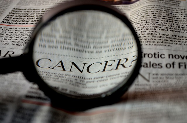 a magnifying glass, newspaper, cancer, CBD and Sunsceen