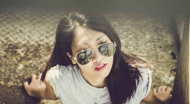 a young woman, sunglasses, sun, CBD and Sunscreen