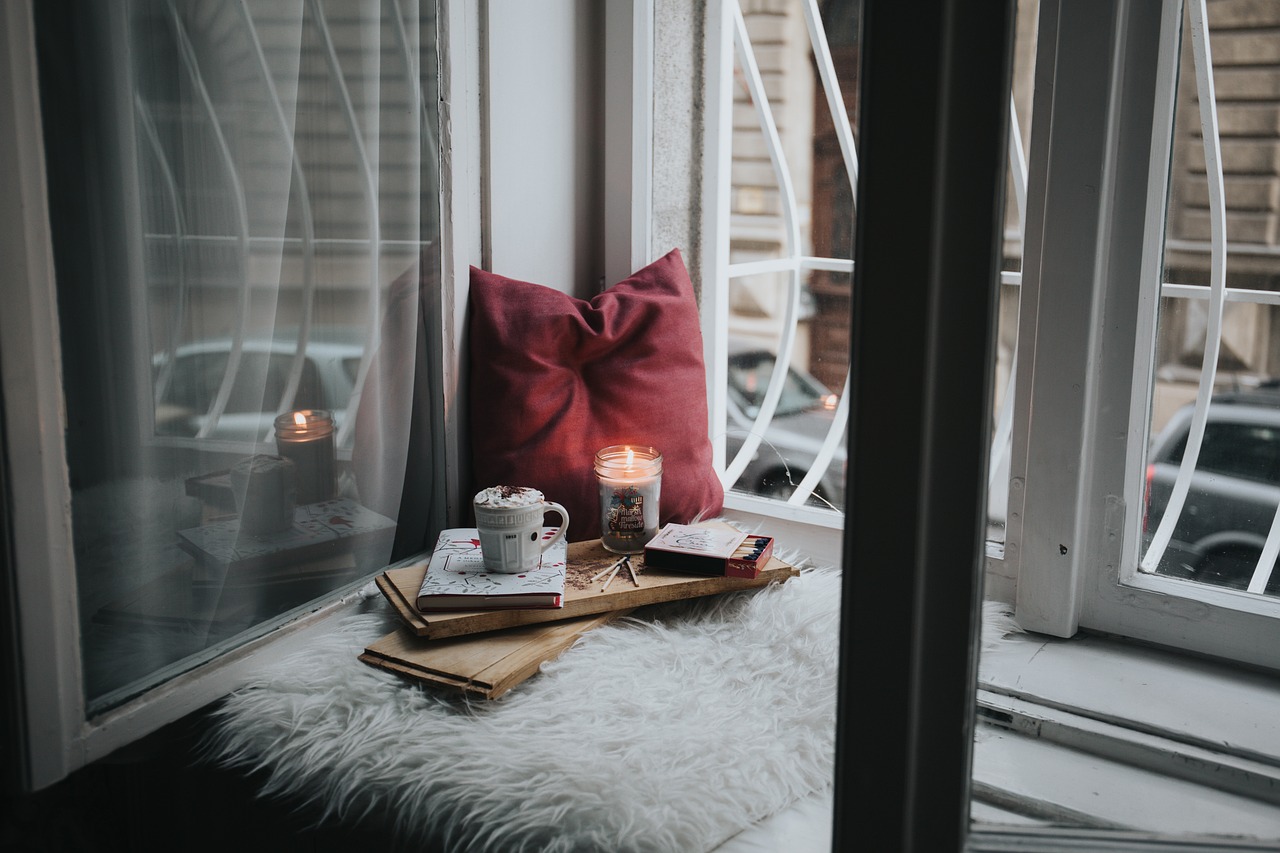 Relaxing, towels, candle, pillow, book